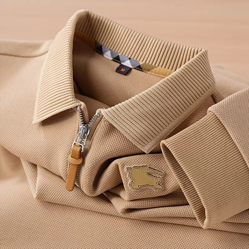 Embellished with a distinctive golden rabbit emblem on the chest